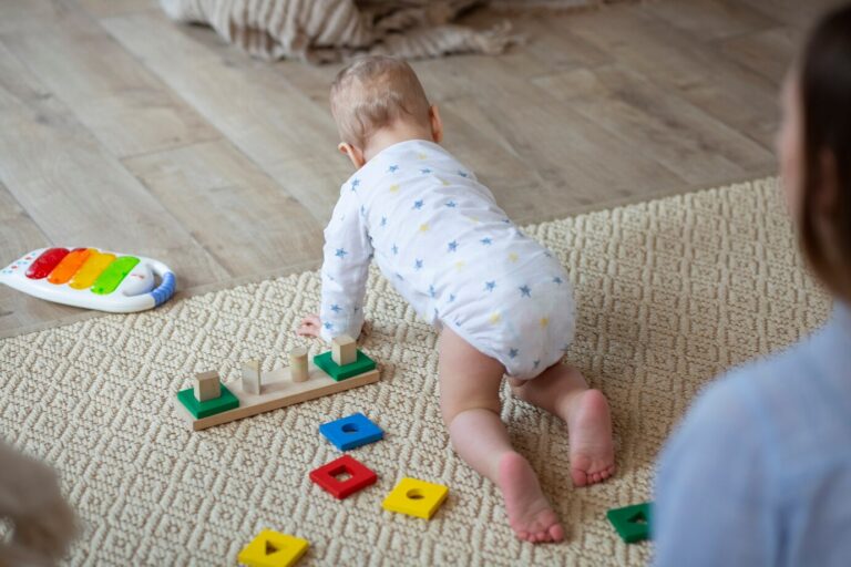close-up-mother-watching-baby-crawl_23-2149320455