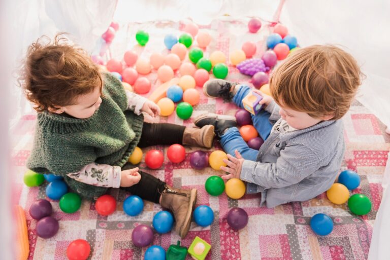 high-angle-view-kids-sitting-inside-tepee_23-2147840672